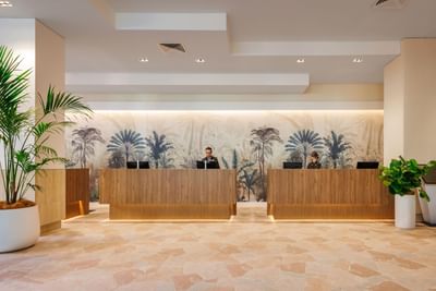 Spacious reception area with two receptionist at Amora Hotel Brisbane