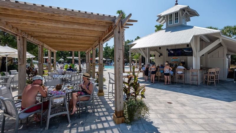 People dining in the canteen outdoor area at WaterColor Inn
