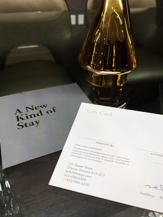 Close-up of a gift card & ornament on a table at ReStays Ottawa