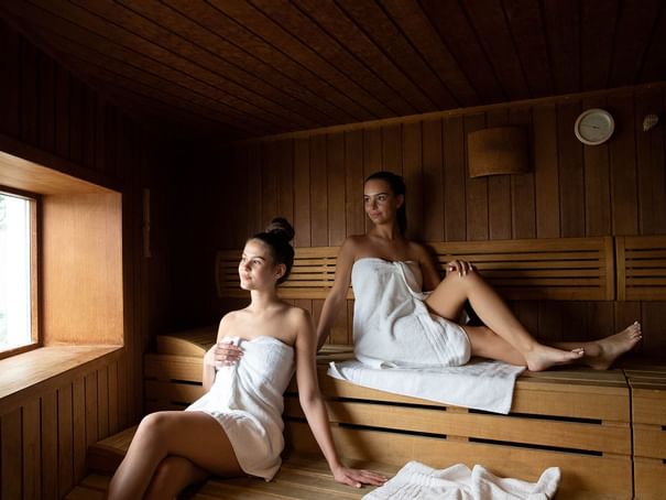 Two girls relaxing in a Spa Sauna at Hotel Berlin Berlin