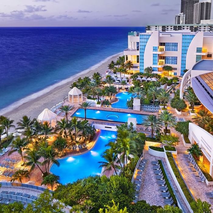 View of our two oceanfront pools and beach in late evening.