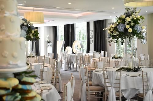Wedding breakfast set up in the garden suite at Gorse Hill in Woking