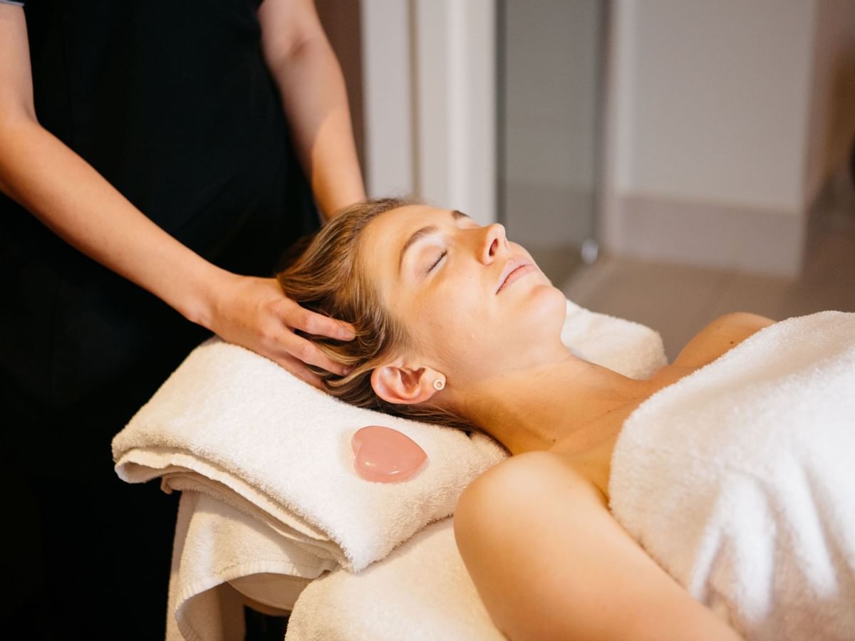 Person receiving a head massage during a spa treatment in Stephanies Spa at Sofitel Brisbane Central