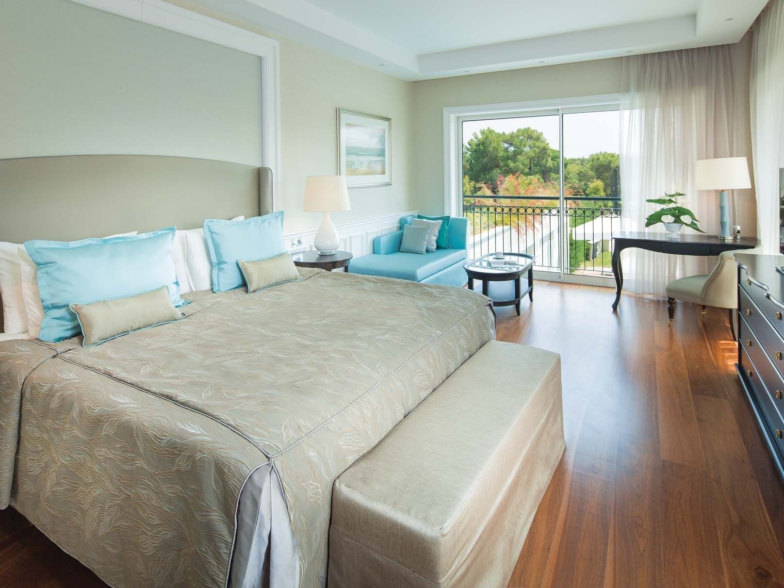 Sitting area by the bed in Exclusive Villa Pool with wooden floors at Titanic Deluxe Golf Belek