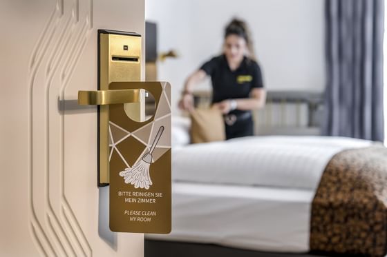 Room attendant arranging a room at Hotel Imlauer Vienna