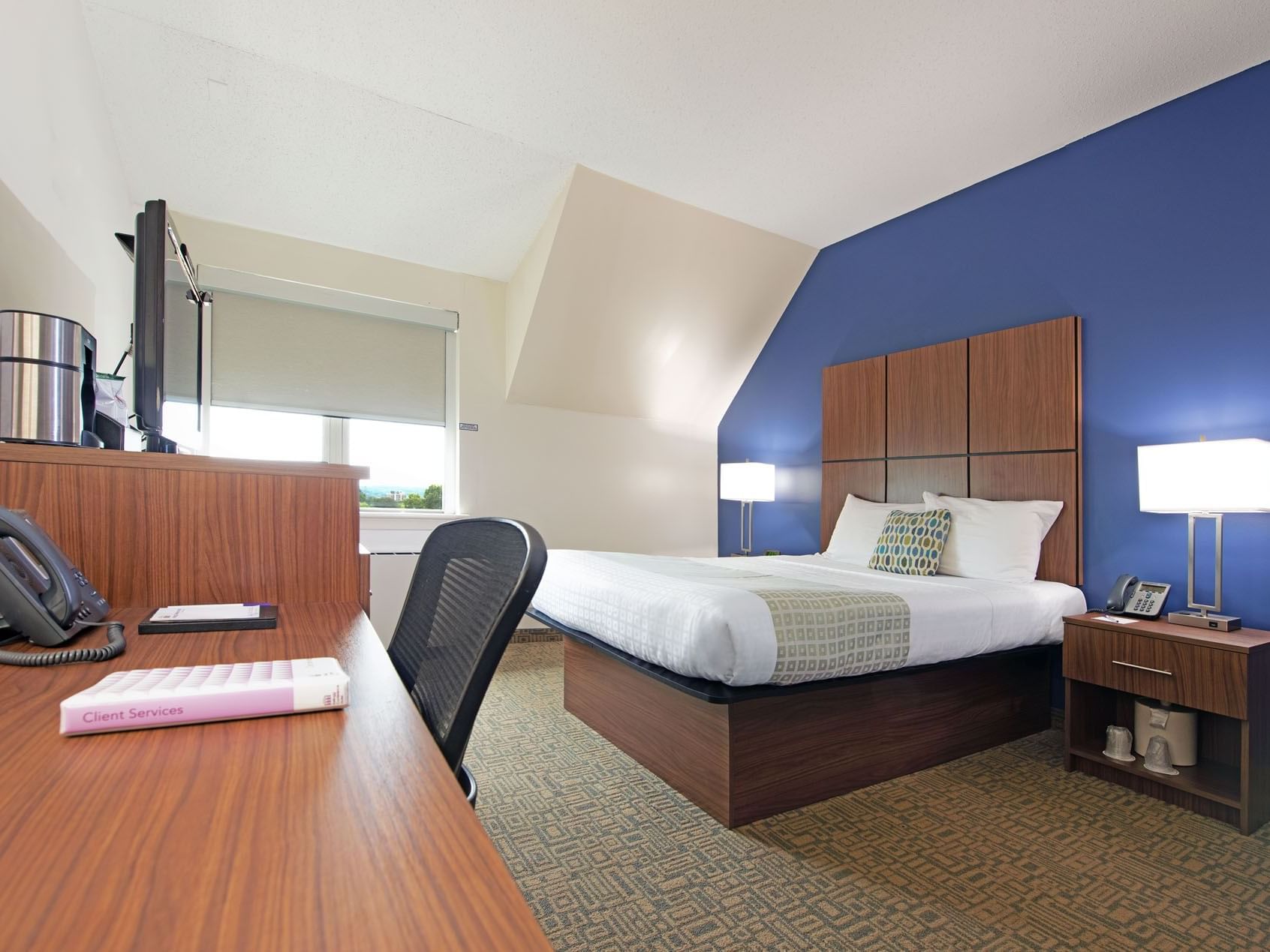 Standard Single Queen bedroom at Kellogg Conference Center