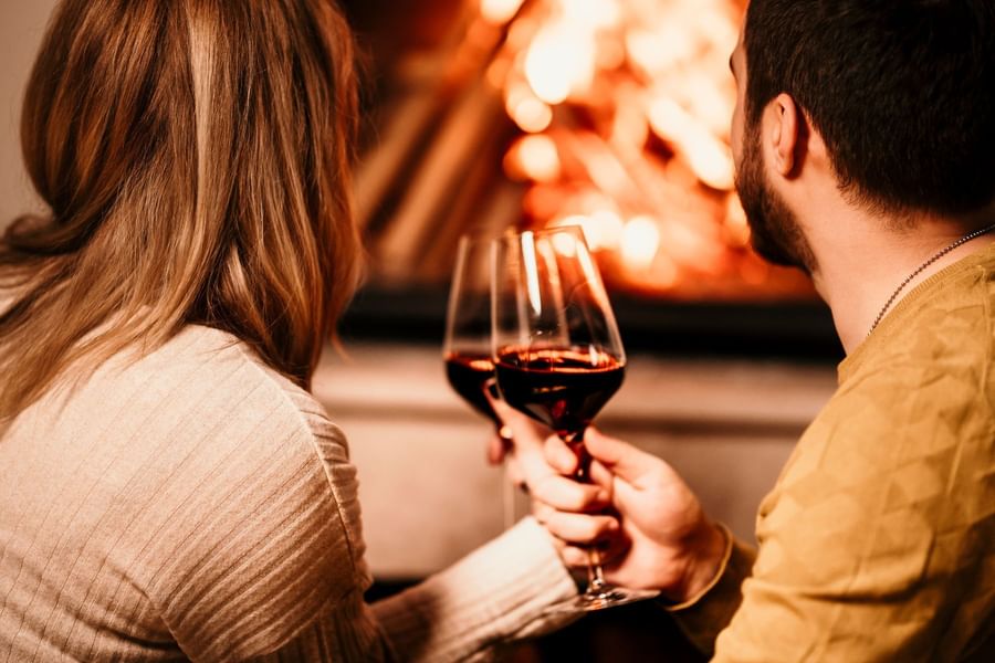 A couple drinking red wine at Lutsen Resort