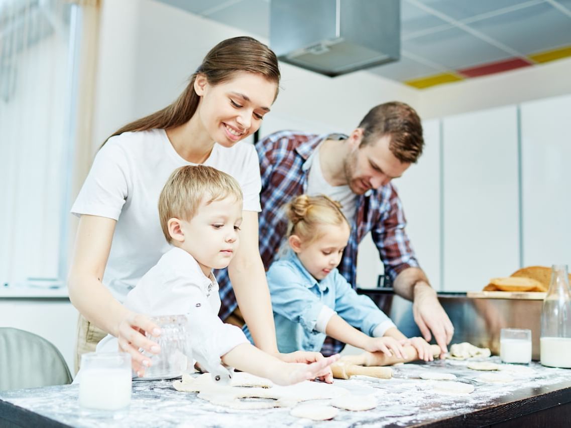 Family baking pastries together