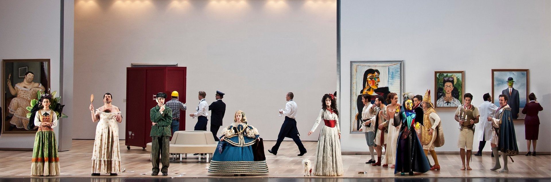 Costumes posing with paintings at Sofitel Sydney Wentworth