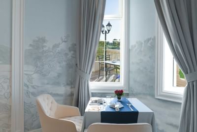 view of a table near a window at Al Aziziyah Boutique Hotel Doha