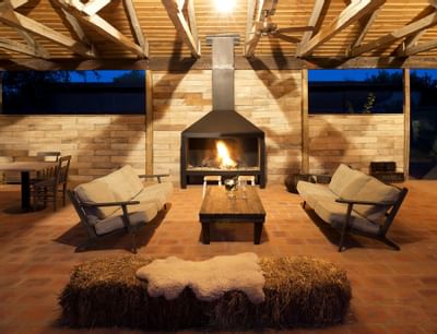Seating & lounge area near a fireplace at Noi Blend Colchagua