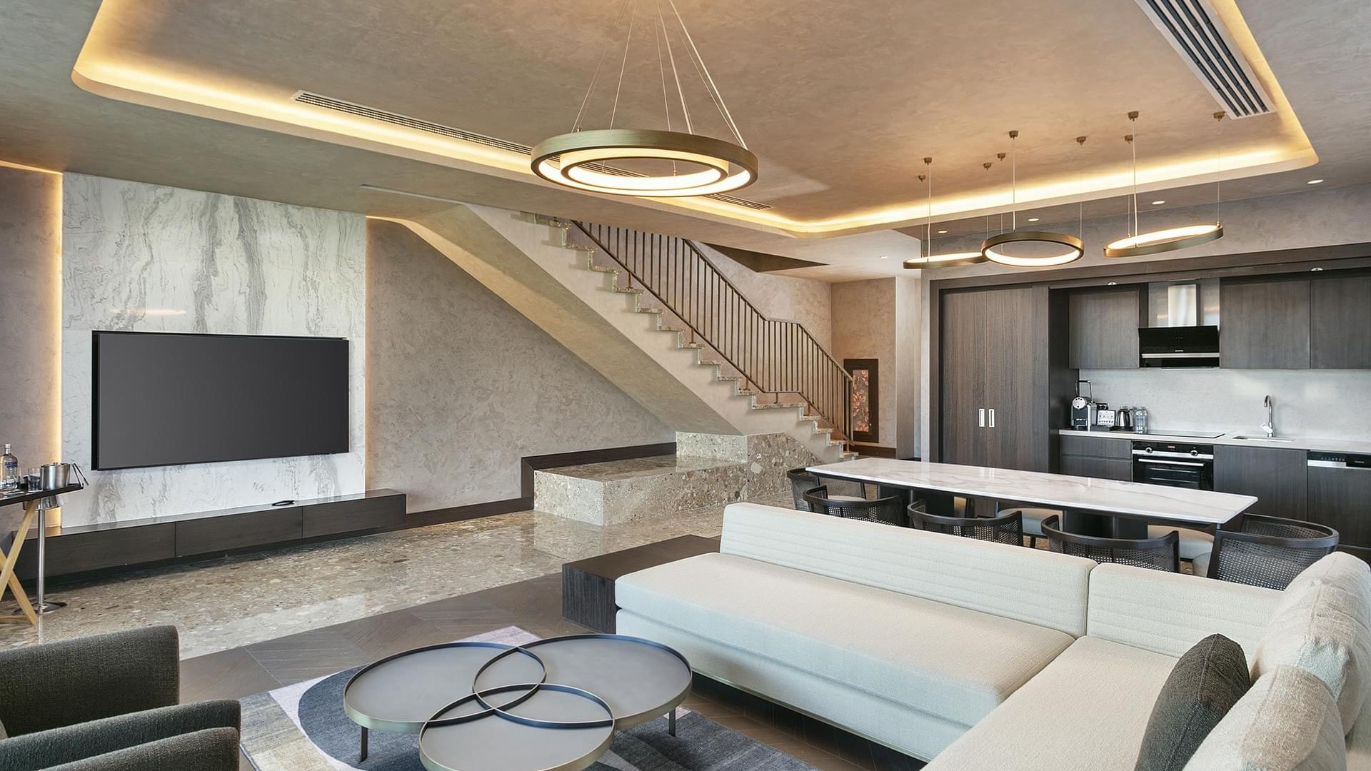 TV lounge area with dining table & staircase in Exclusive Villa in Cullinan Belek