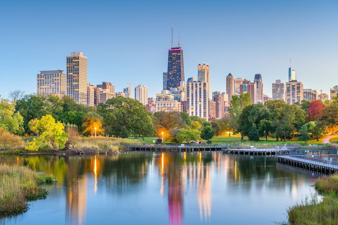 Urban skyline with tall buildings and a waterfront park near Warwick Allerton Chicago