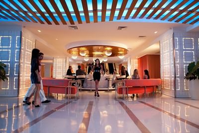 Waitress serving at the indoor dinning area in Condado Plaza