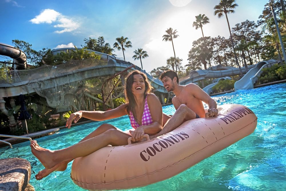 Couple on the lazy river of Disney's Typhoon Lagoon near Lake Buena Vista Resort Village & Spa