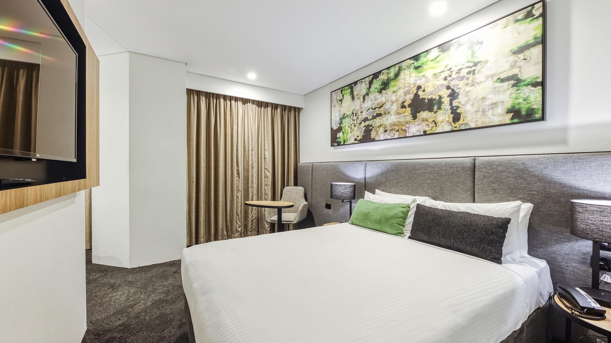 Modern Superior Family Room with white bedding, artwork, and chair at Mercure Penrith, Penrith.