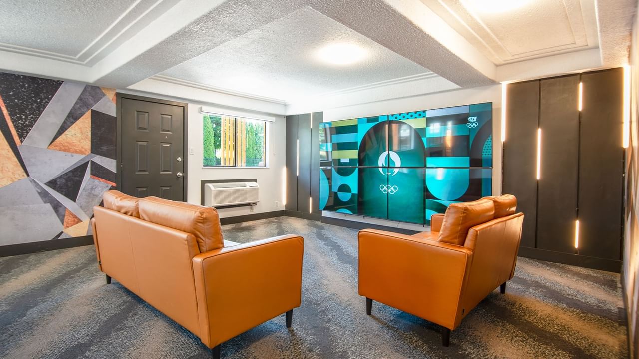 Lobby of Coast Courtenay Hotel with large TV and couches