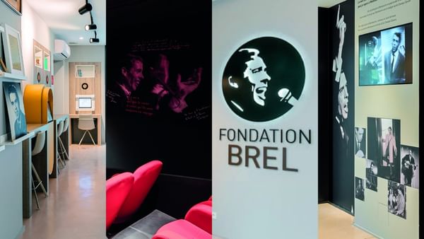 Fondatio Brel interior with red chairs in a cinema area by a lounge space near Warwick Grand Place Brussels