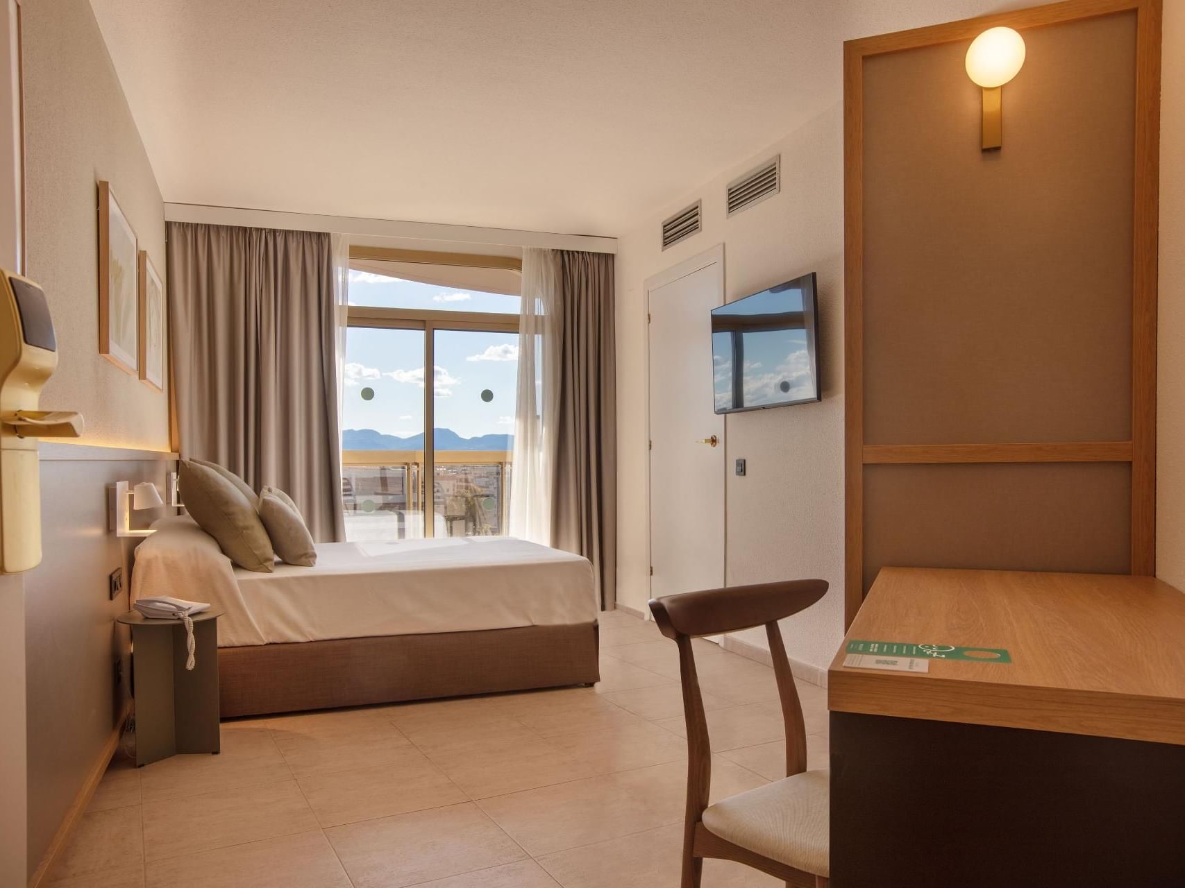 TV & work desk by the bed in Accessible Room at Ponient Dorada Palace