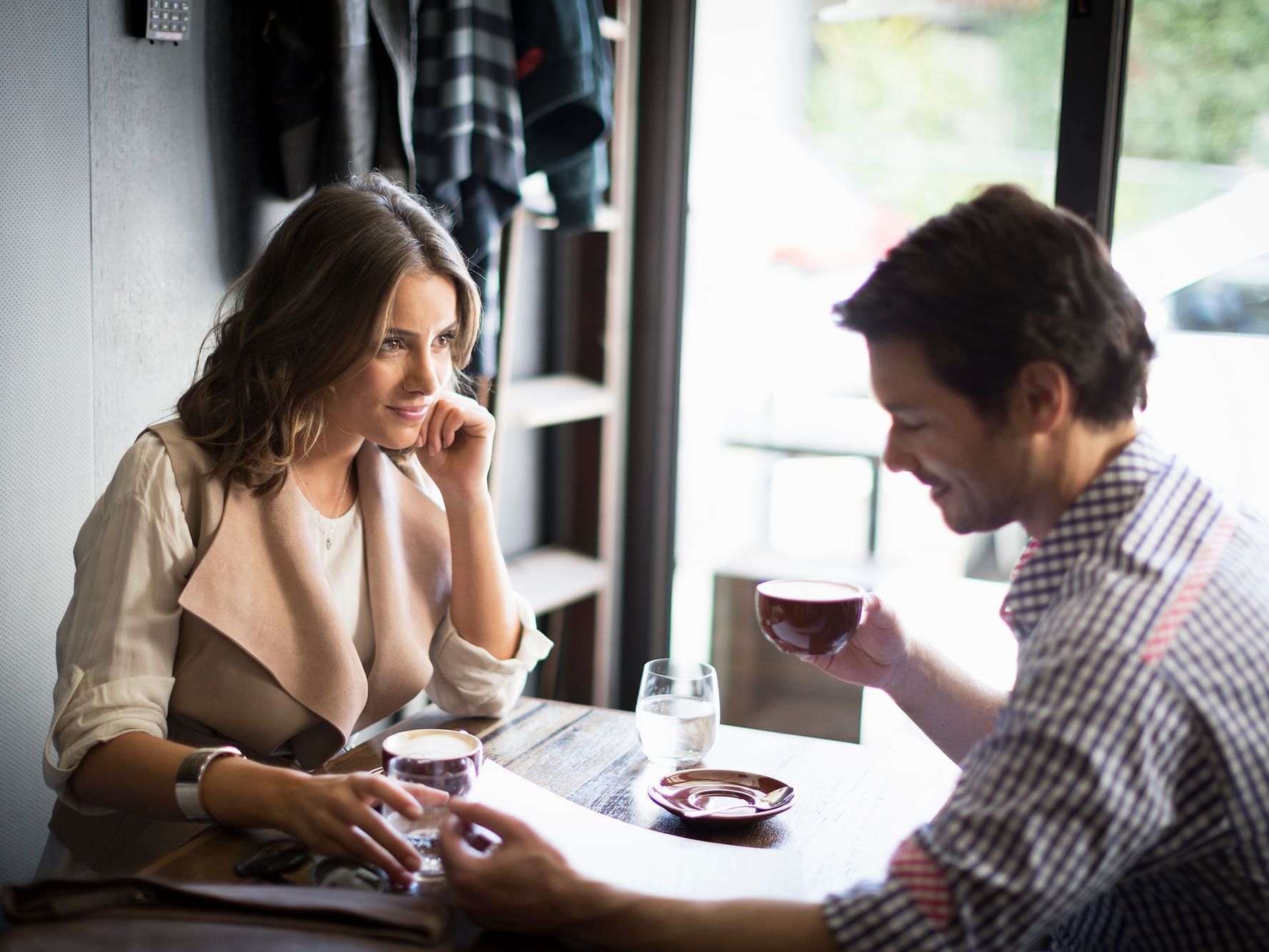 Couple having coffee at Chapel Street near The Como Melbourne