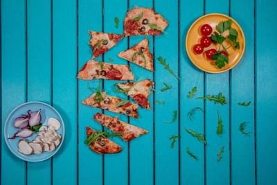 Close-up of Pizza slices served at Amsterdam Manor Resort