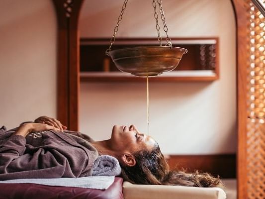 A lady getting Ayurvedic treatments  at Liebes Rot Flueh