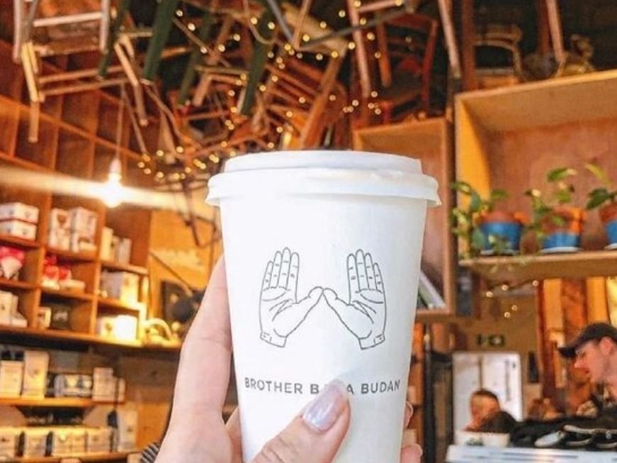 Close up of a lady holding coffee cup at Brady Hardware Lane