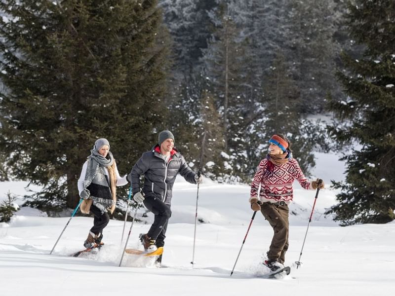 Three hikers while winter hiking near Falkensteiner Hotels