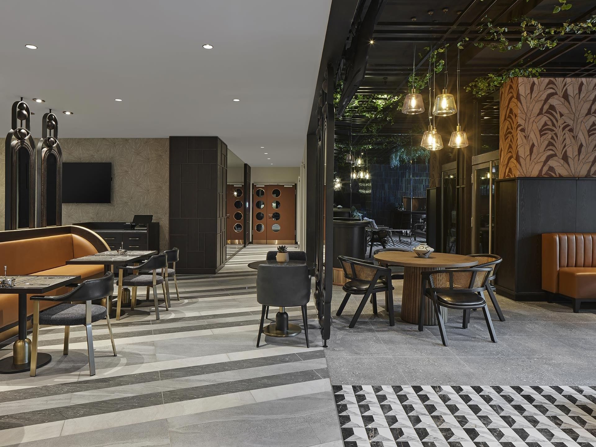 Cafe interior with plush seating and ornaments in Winter Garden at Titanic Comfort Kurfürstendamm