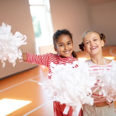 Kids practicing cheerleading together at Falkensteiner Hotels