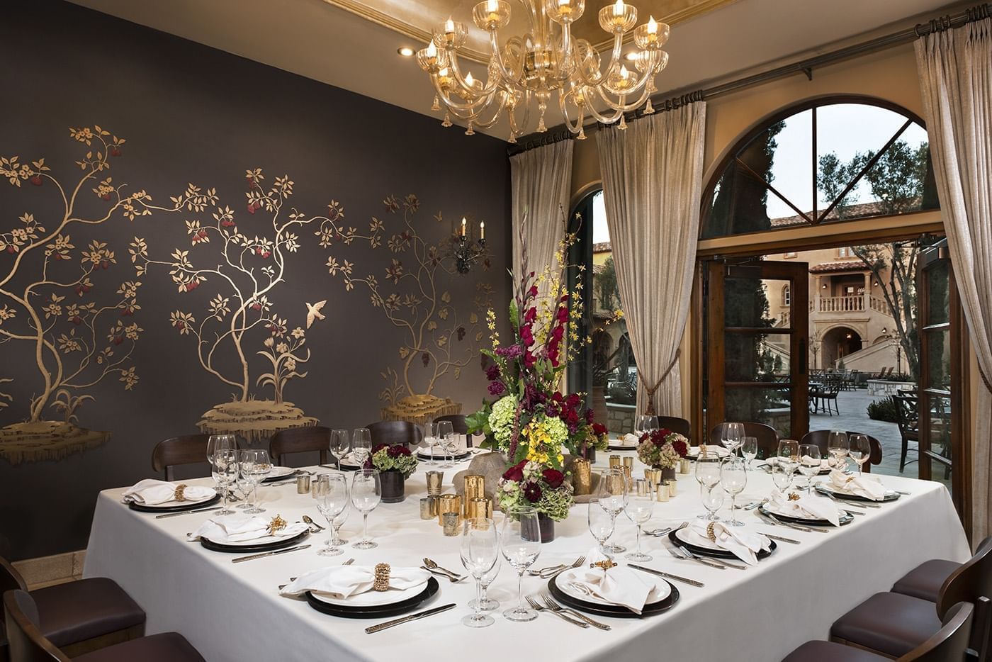 The Murano Private dining room prepared for a party of 14
