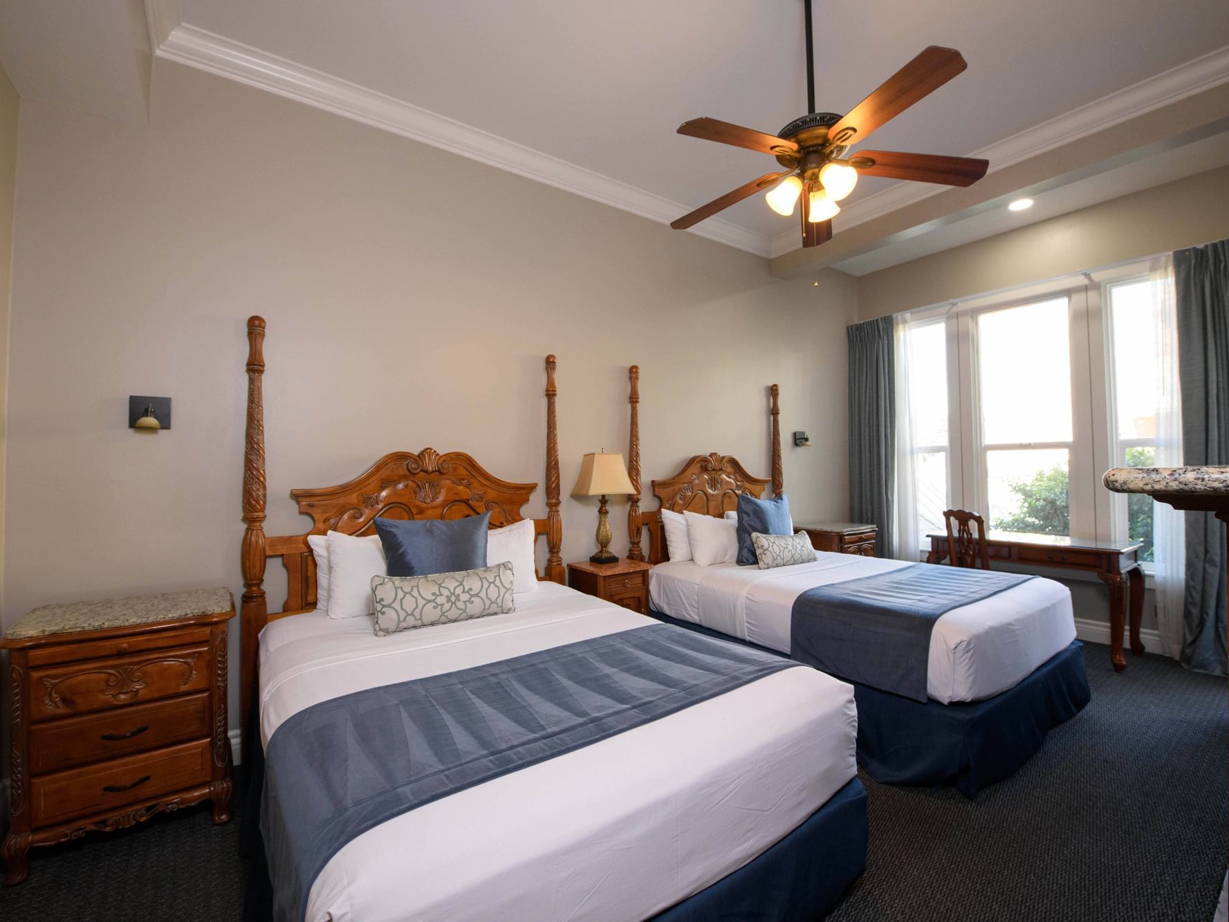 2-Queen Beds & ceiling fan in a room at Horton Grand Hotel