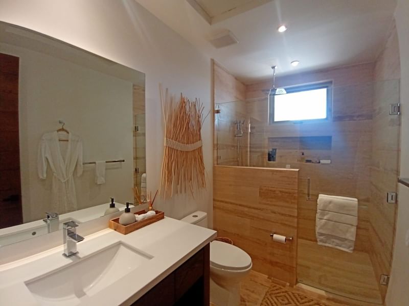 Bathroom interior with vanity mirror and shower area at Live Aqua Private Residences La Paz
