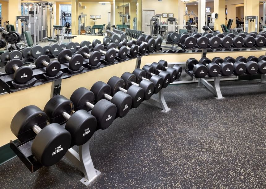 Gym interior with mirrors & dumbbell racks in Ogunquit Fitness Center near Meadowmere Resort