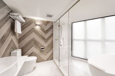 Bathroom with a marbled interior in Deluxe Suite Bathroom at Park Hotel Hong Kong