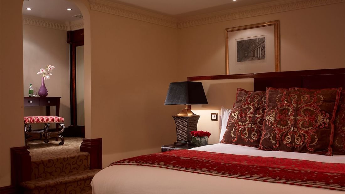Large bed & nightstand in Library Suite at Guoman Hotels