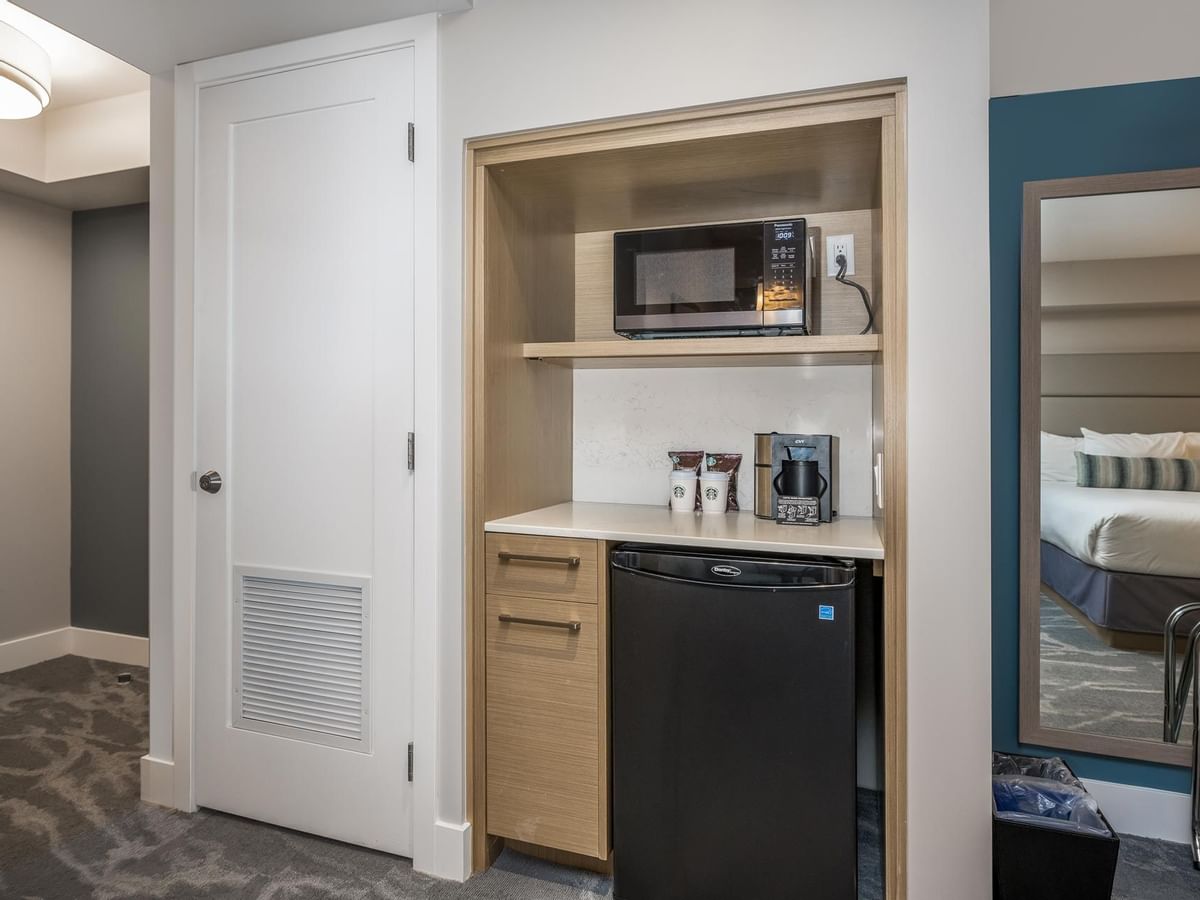 View of kitchenette with microwave, coffee maker and mini fridge in our Coast Acessible Two Queens Bedroom