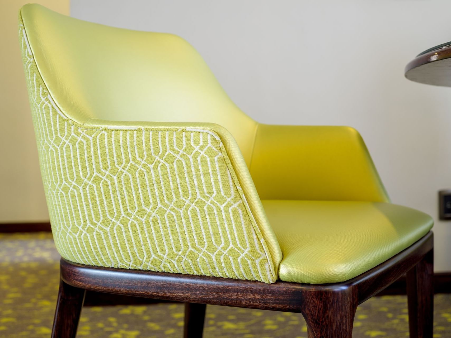 Closeup on a chair in a bedroom at Ritz Apart Hotel