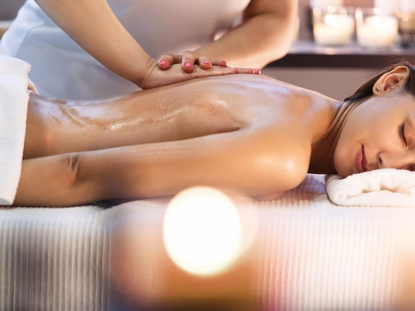 Lady getting body massages from spa at Grand Fiesta Americana