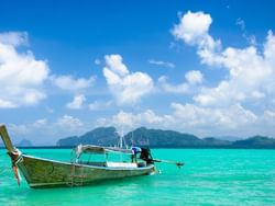 Long-tail boat in the Kradan Island near Hop Inn Hotel