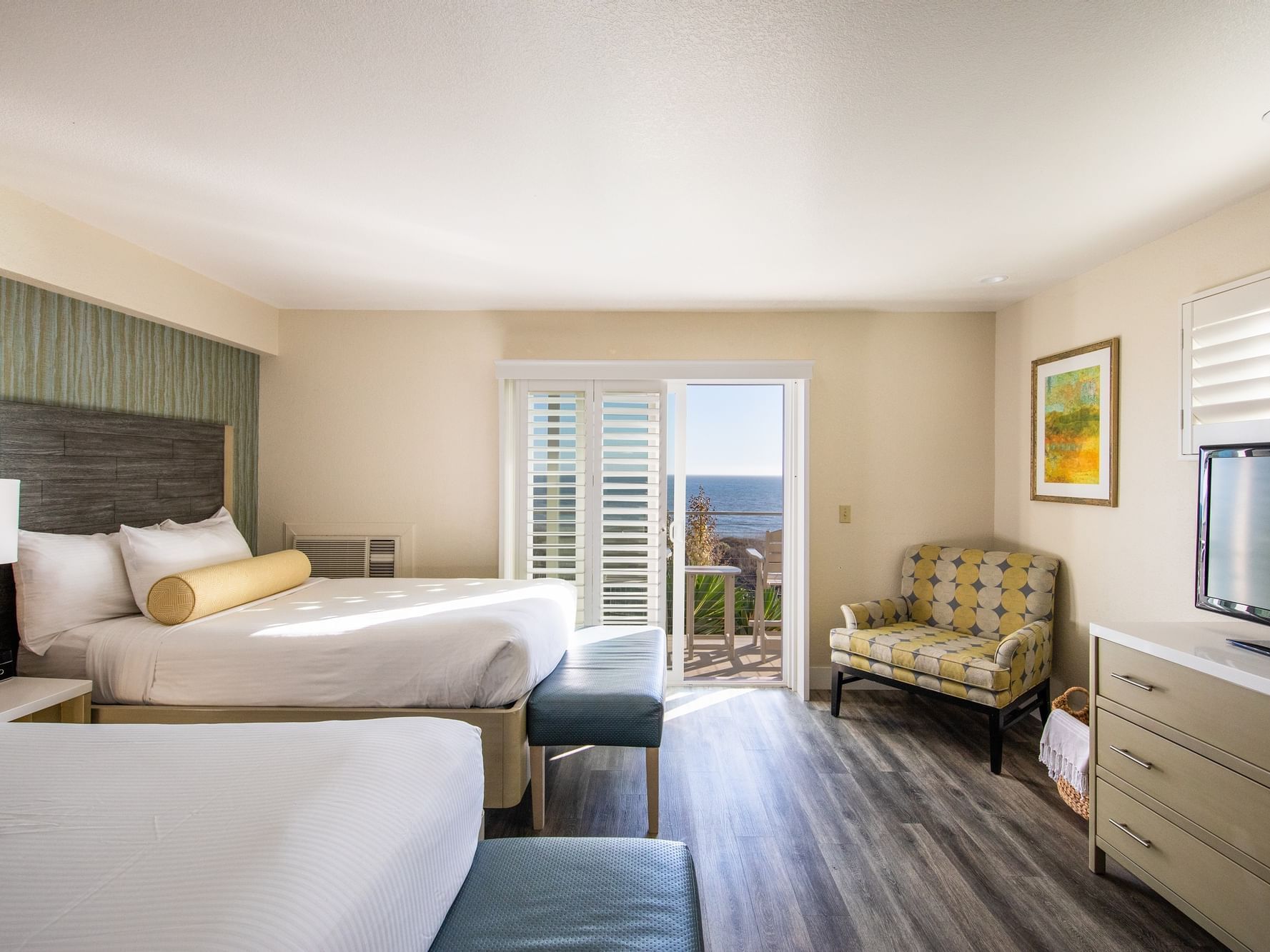 Dog Friendly Oceanfront two doubles room with beds, TV, and outside access