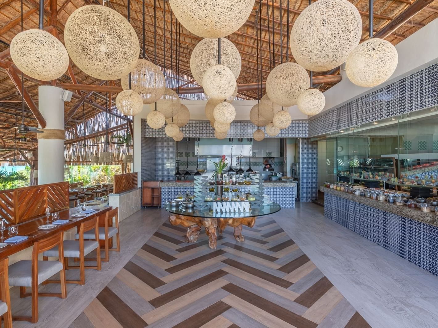 Azur restaurant with spark ball chandelier at La Colección