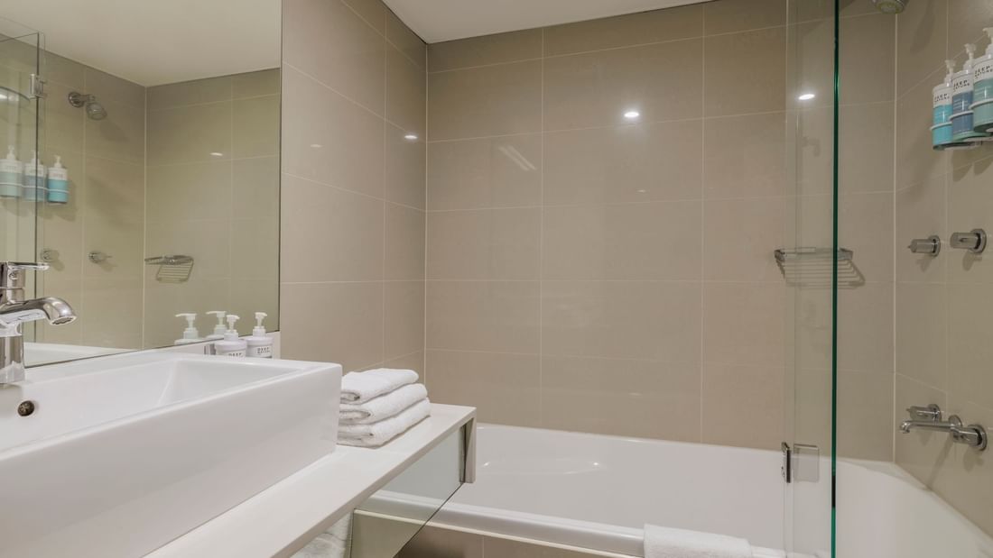 Bathroom with vanity and bathtub in Superior Spa Suite at Novotel Sydney Olympic Park