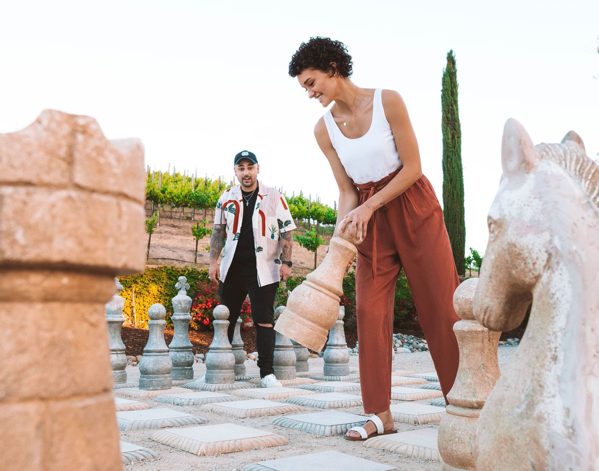 Lorem ipsum Women holding life size chess piece