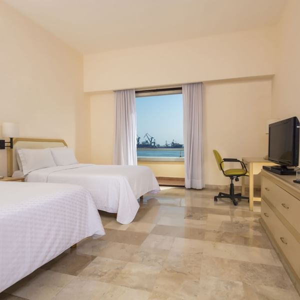 Twin beds with ocean view in Superior Room at Fiesta Inn