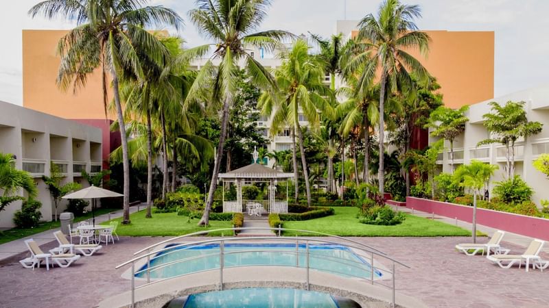 Aerial view of the pool with sun loungers at Gamma Tampico