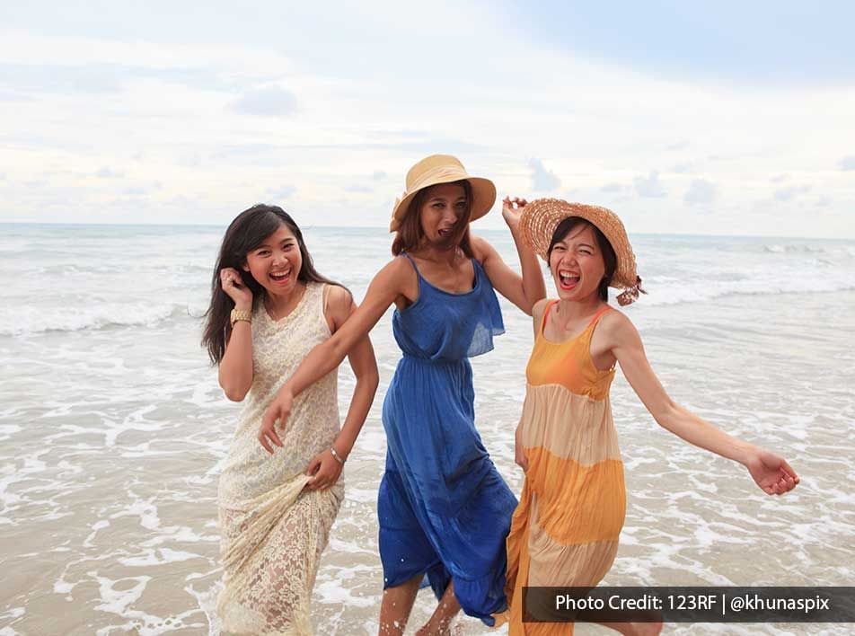 Three women are having their great vacation time at the beach - Lexis PD