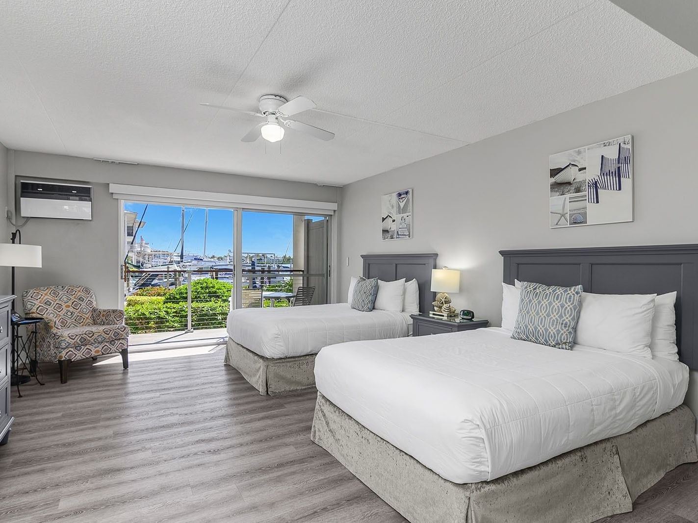 Bayside ADA Accessible room with two beds, a balcony, and modern decor at Cove Inn at Naples Bay, Naples.