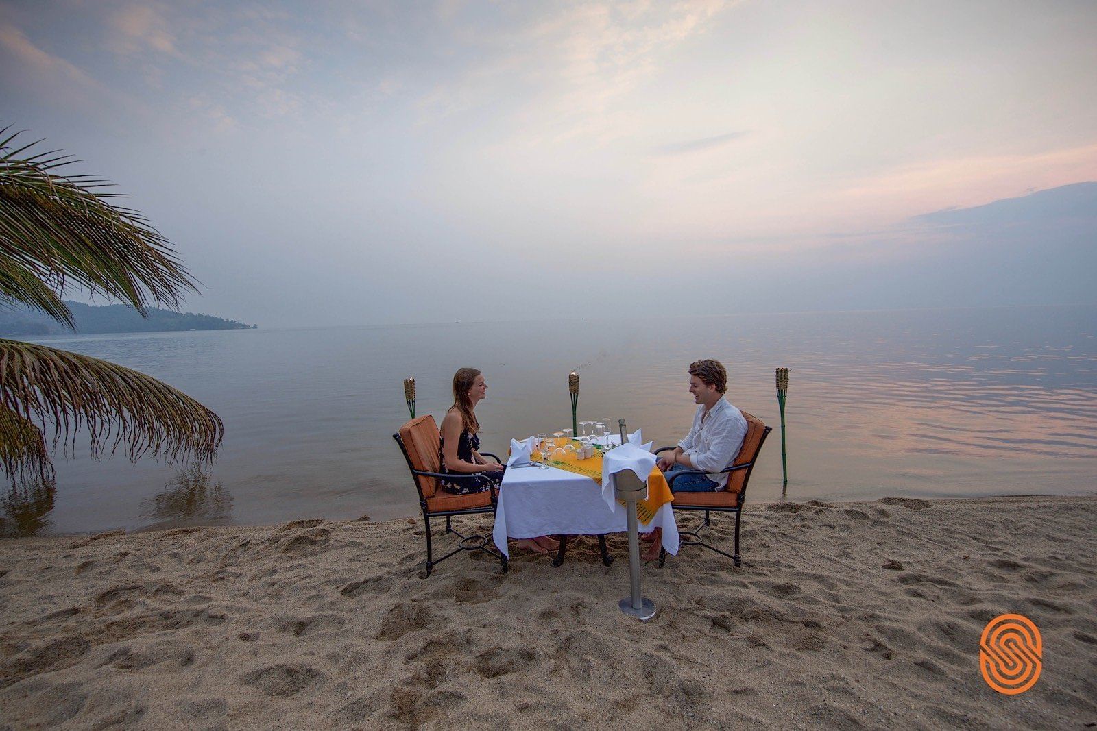 Couple at a Sunset dinner in Lake Kivu Serena Hotel 