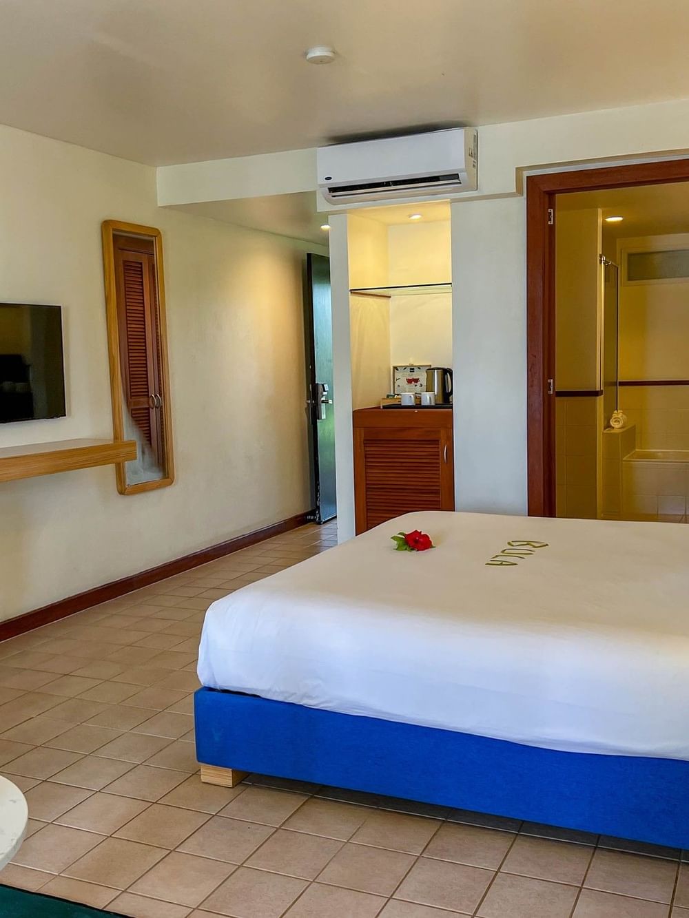 Elegant suite bedroom with modern amenities at The Naviti Resort in Korolevu.